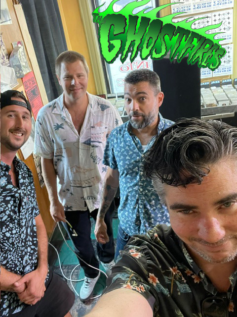 The four members of The Ghostfires posing together at a record store.